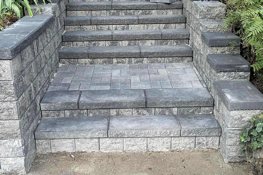 Tiered interlock entry steps flanked by block retaining walls
